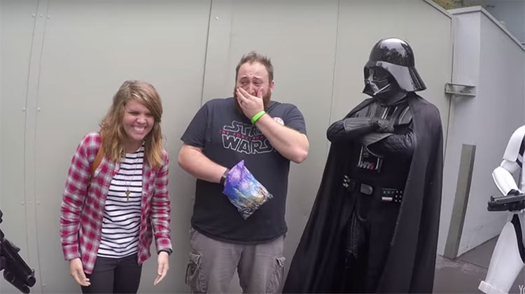 husband shocked with pregnancy announcement in Disney World