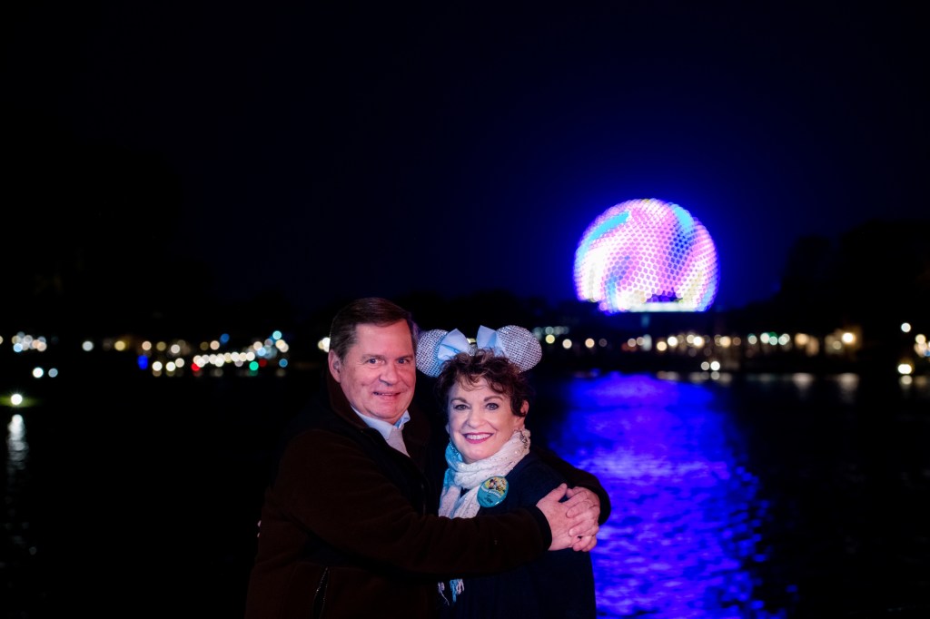  Jane Treacy smiles and poses with her husband at Disney.
