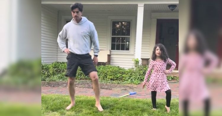 This dad and daughter have a cute dance routine.