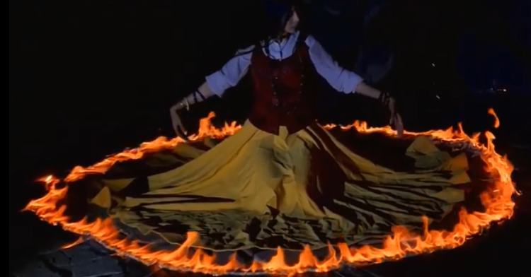 Dancer performing traditional Persian Sama ceremony, dancing with fire.