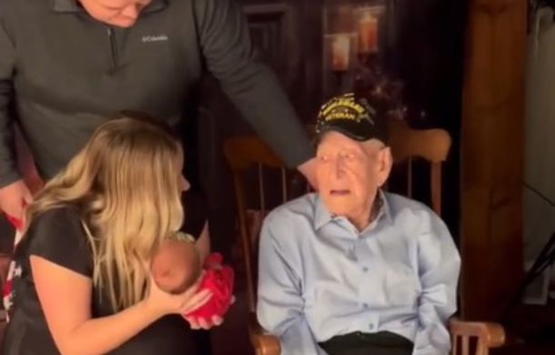 veteran looks at great grandchild