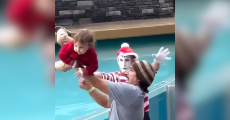 parent tosses kid into pool with mime watching