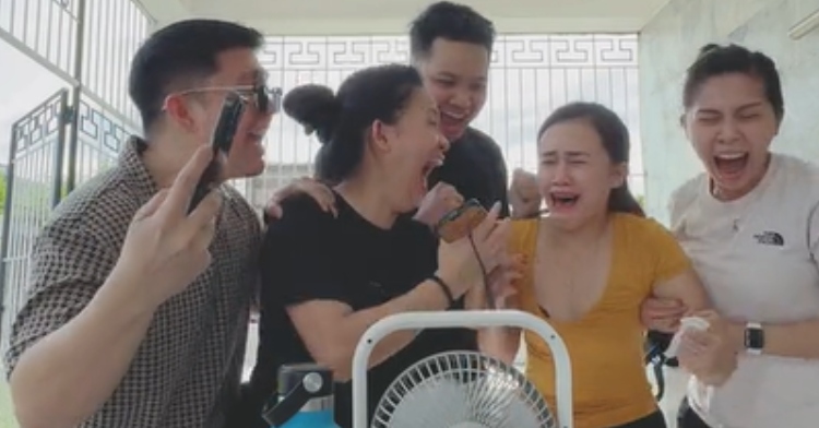 Trisha Amoranto gathers with friends to see the results of her taking the bar exam. They're all screaming and Trisha looks like she's starting to cry.