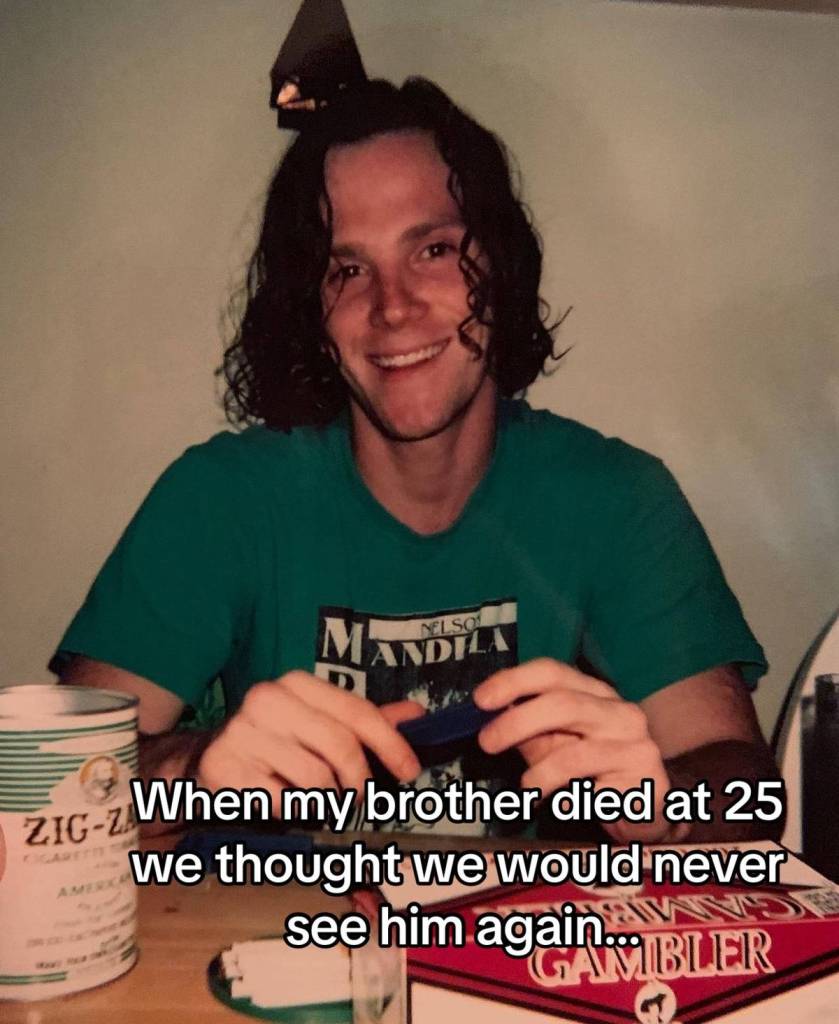 A man smiles as he sits at a dining table. Text on the image reads: "When my brother died At 25 we thought we would never see him again..."