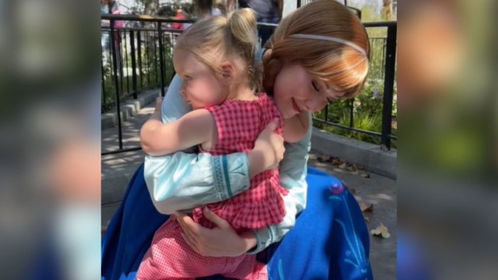 Toddler Puts Disney Hug Rule To The Test When She Won't Let Go