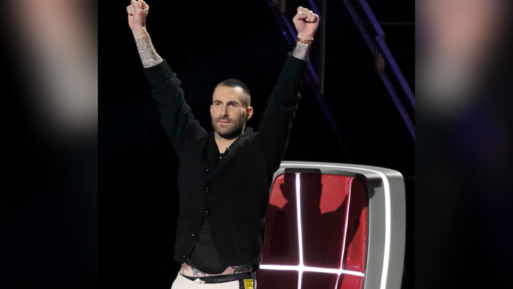 adam levine holding his arms up on the voice