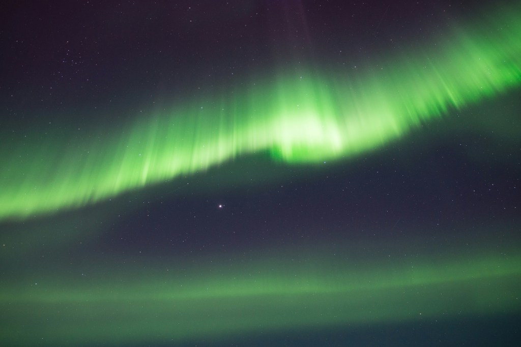 A view of the northern lights in the night sky. 