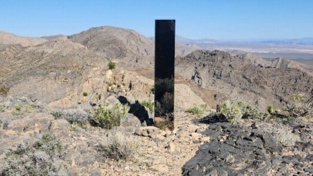 From afar, a view of a mirrored monolith in a Las Vegas desert.