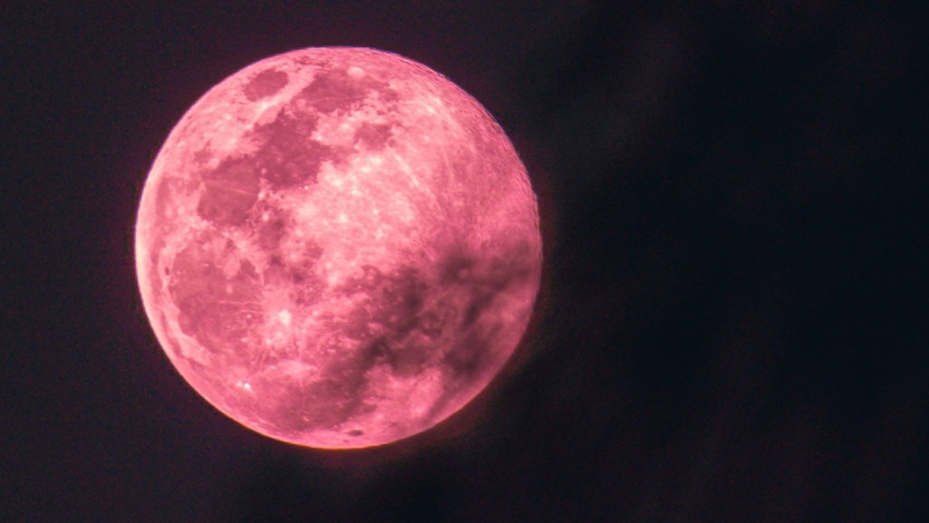 View of a pink full moon, much like the strawberry moon in June.