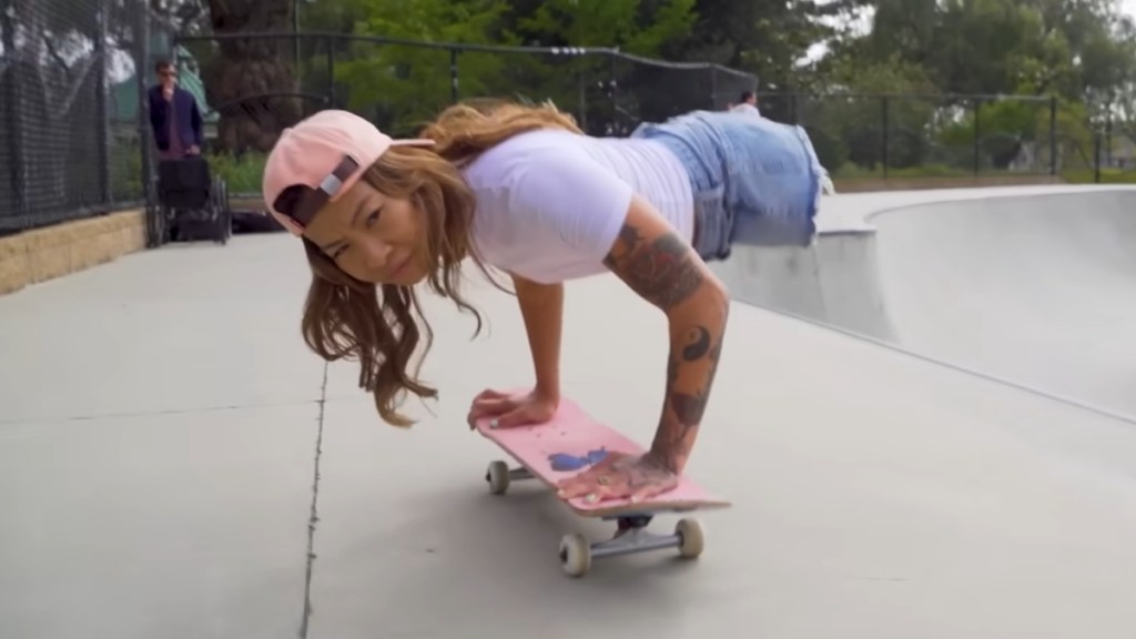 Kanya Sesser, who doesn't have legs, uses her hands to ride a skateboard