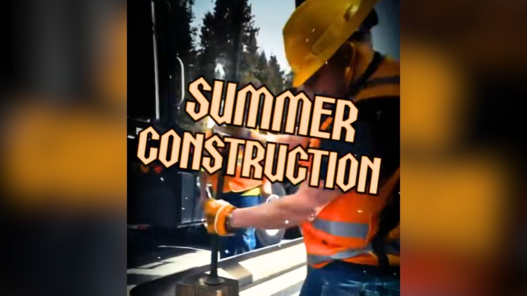 Someone works on road construction with this text edited over him: SUMMER CONSTRUCTION