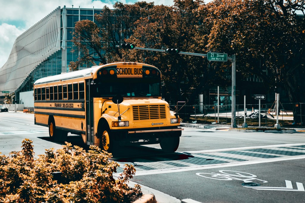 A school bus driving down the street.