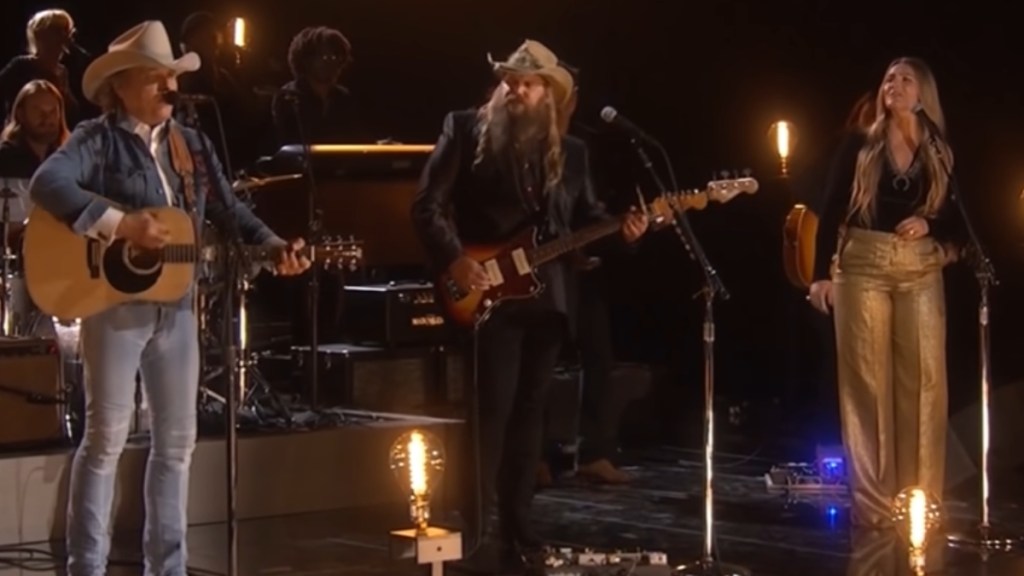 Dwight Yoakam, Chris Stapleton, and Morgane Stapleton sing on stage together