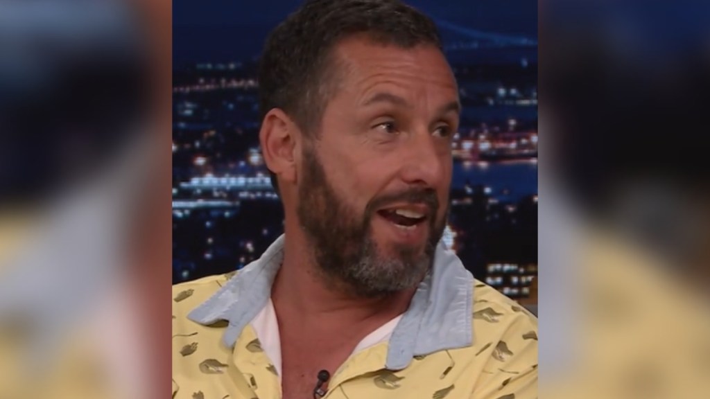 Close up of Adam Sandler smiling as he talks on "Fallon Tonight"