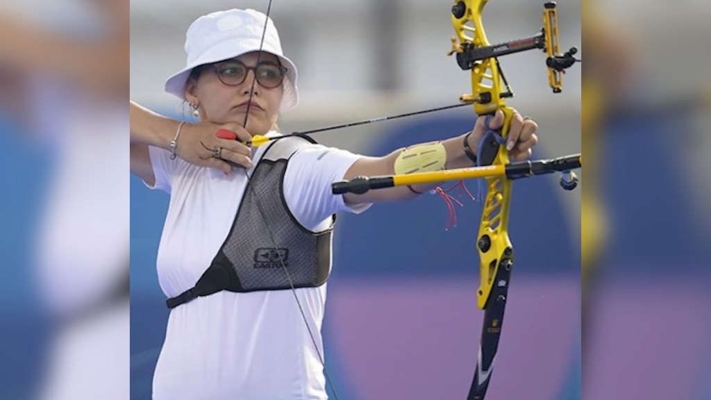 Yaylagul Ramazanova concentrates as she holds up her bow, ready to shoot, at the Olympics