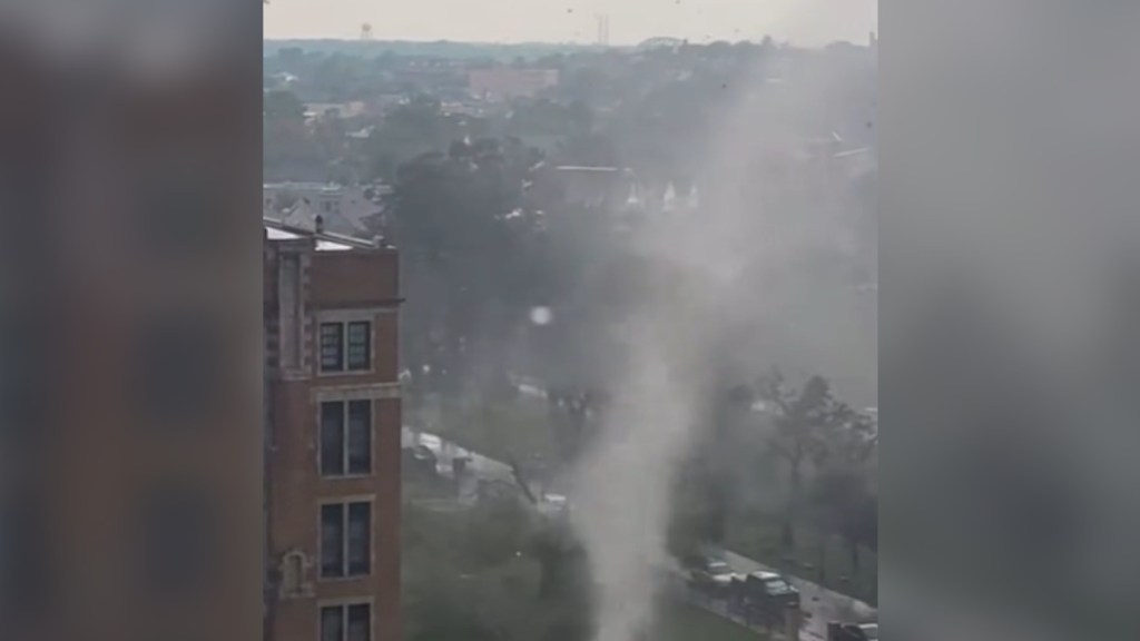 View at a distance of a tornado forming amidst buildings in Buffalo, New York