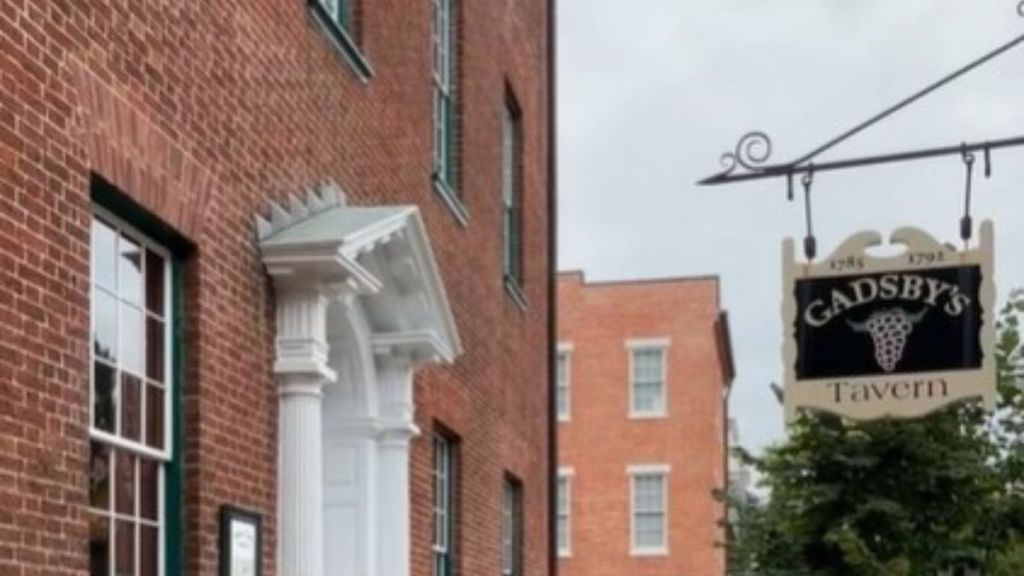 Image shows the outside of Gadsby's Tavern visited by George Washington that is still open in Alexandria, Virginia.