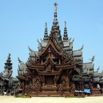 Stock image shows the Sanctuary of Truth in Thailand against a blue sky.