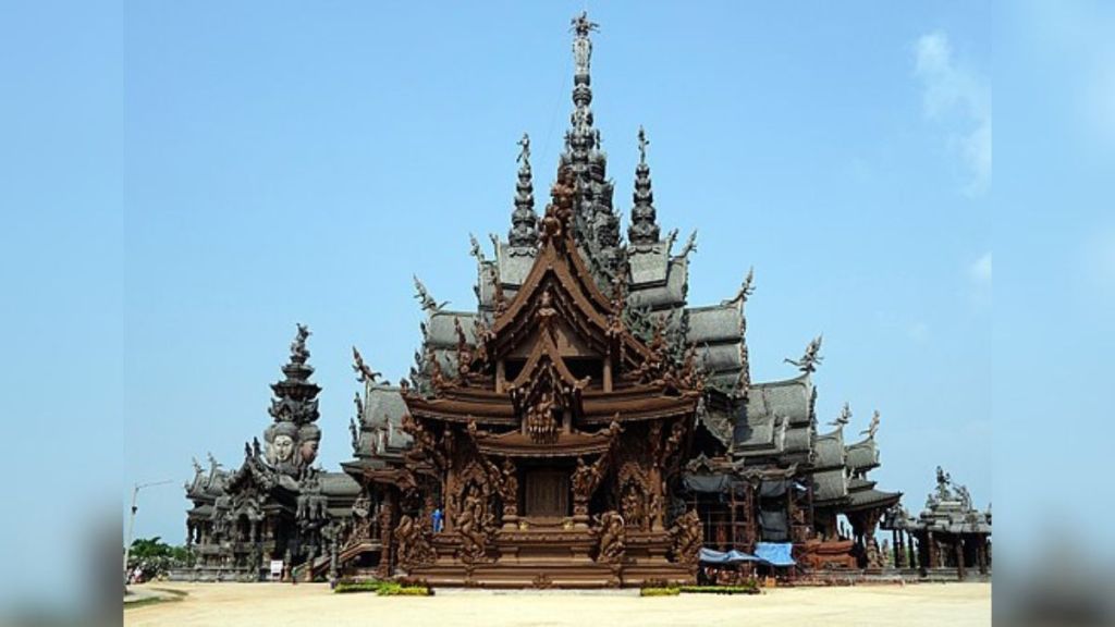 Stock image shows the Sanctuary of Truth in Thailand against a blue sky.