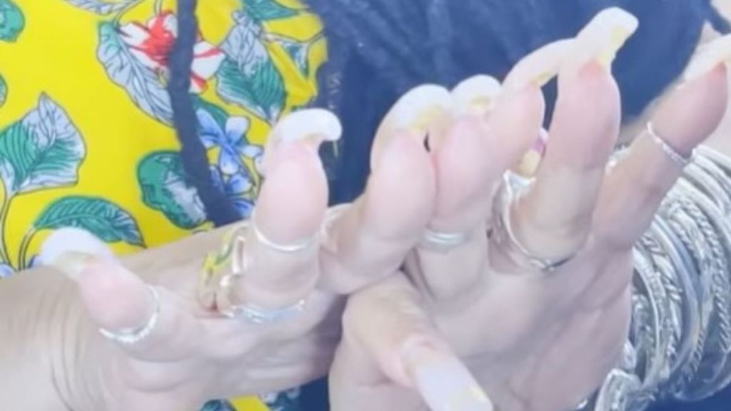 Image shows the hands of Ayanna Williams, the world record holder for longest fingernails, after getting her nails cut for the first time in 29 years.