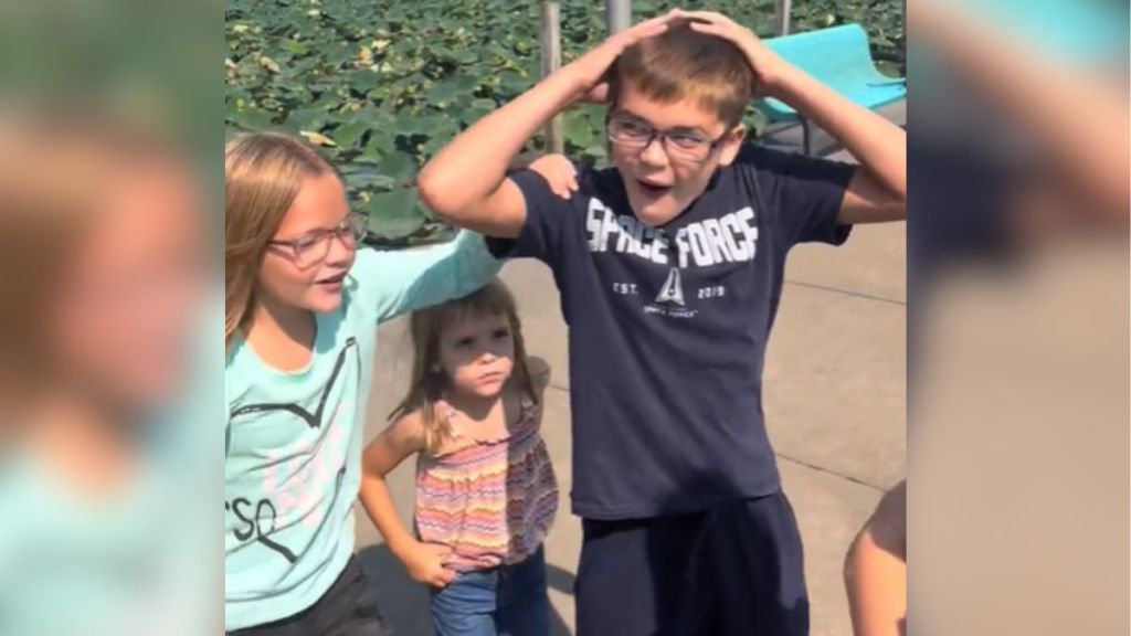 A group of kids looking totally surprised.