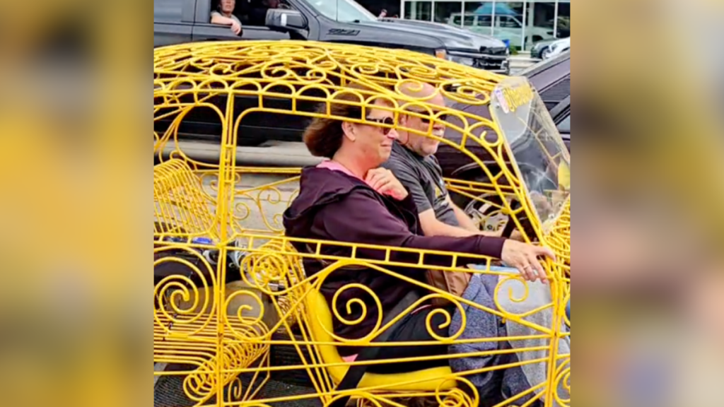 man and woman in volkswagen beetle made of iron