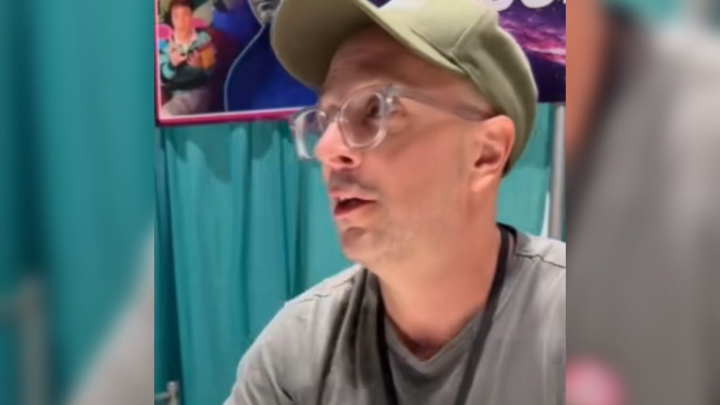 Close up of Steve Burns from "Blue's Clues" talking at a convention to a fan, who we can't see in this photo