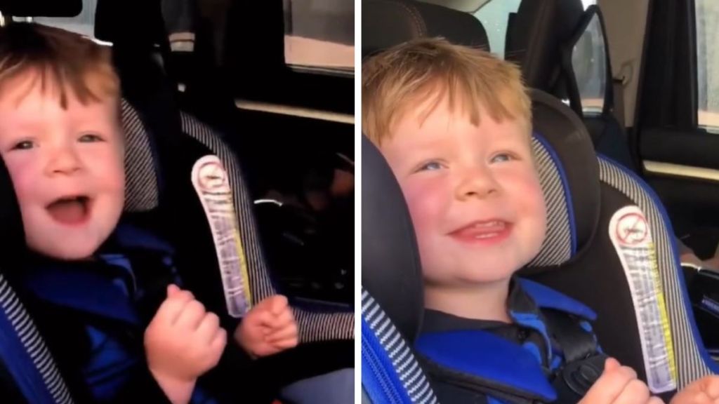 Images show a toddler in a car seat as he shows off some "old man" mannerisms when he greets his mom.