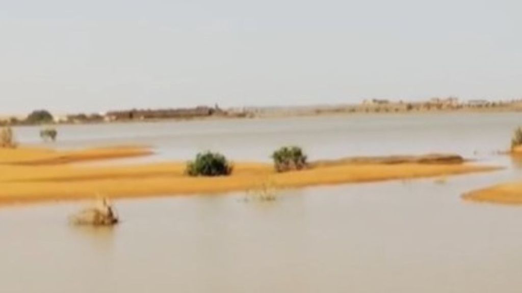 Image shows a wide angle view of accumulated/standing water on the Sahara Desert following flood-level rainfalls.