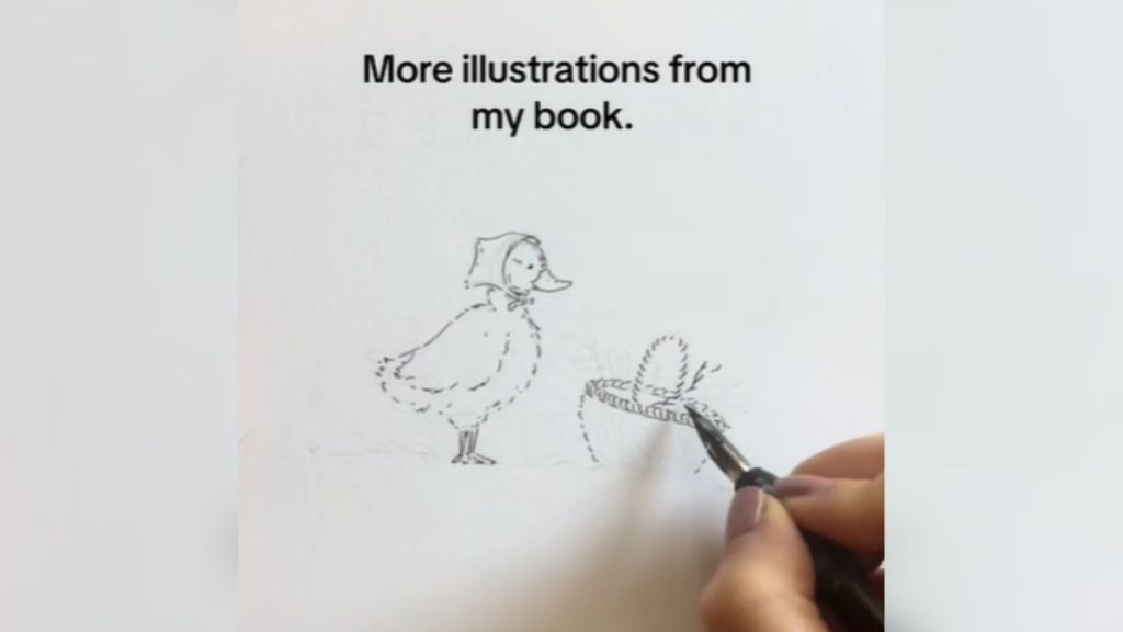 A hand drawing a picture of a duck.