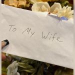 An envelope that reads "To My Wife."