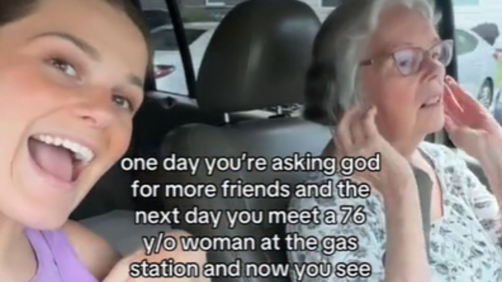 A young woman sitting in the car with her elderly friend.