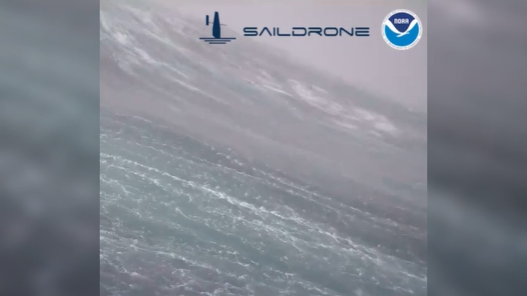 View of massive waves within Hurricane Milton. Logos of Saildrone and NOAA have been edited onto the image