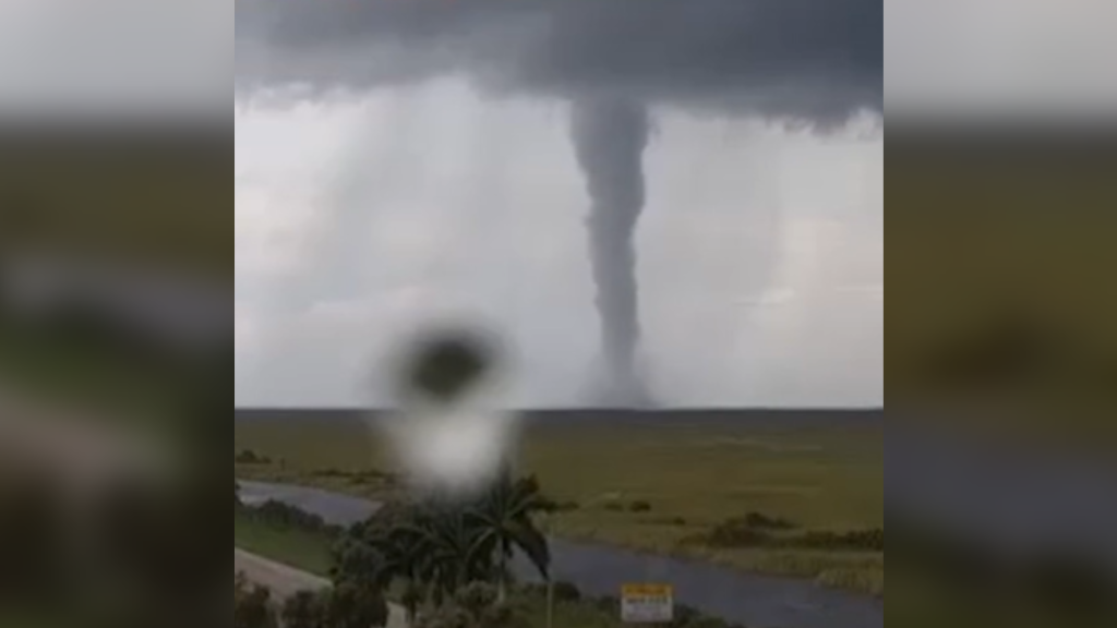 Toll plaza camera footage of a massive tornado crossing the highway in Florida during Hurricane Milton