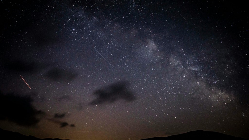 A beautiful night sky that's lit up slightly to give views of a meteor shower