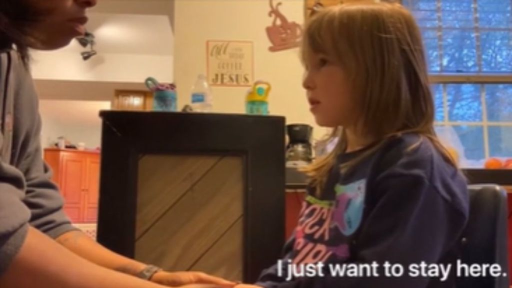 A little girl talking to her foster mom.