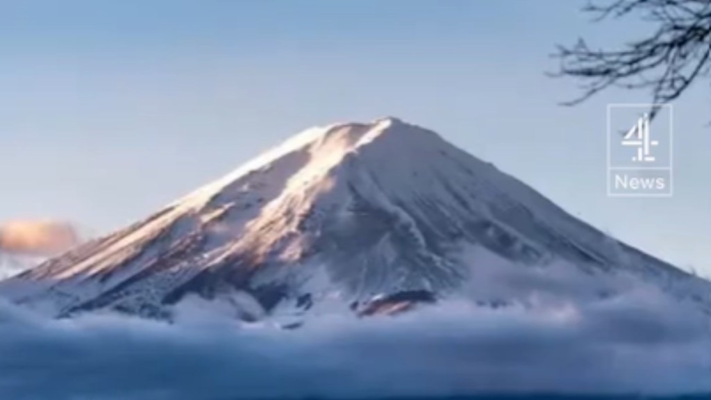 Far-away view of a snow-covered Mount Fuji