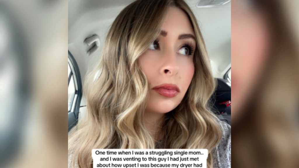 Selfie of a woman named Livi sitting in her car. She looks off to the side, staring in the distance. Text on the image reads: One time when I was a struggling single mom... and I was venting to this guy I had just met...