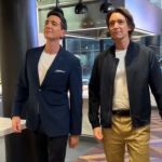 James and Oliver Phelps walking side by side.