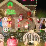 Exterior of home that is covered in lights and other various Christmas decor