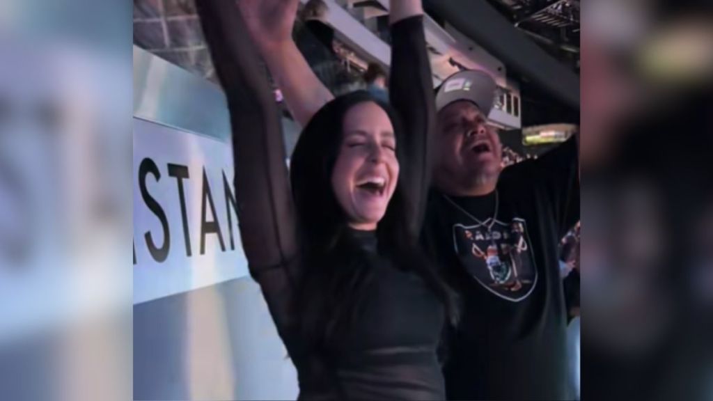 A woman and an older man having fun at a concert.