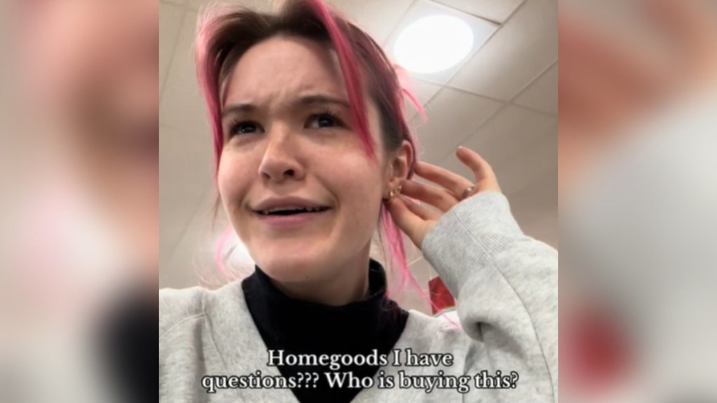 Close up of a woman looking puzzled. With one hand she's moving some of her hair behind her ear. Text on the image reads: Homegoods I have questions??? Who is buying this?