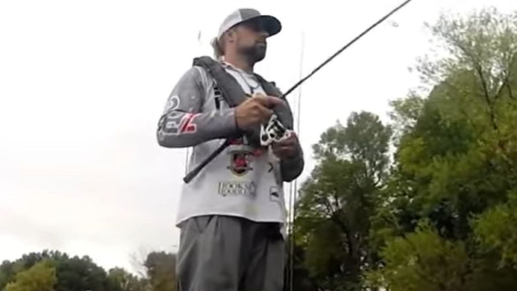 A fisherman using a fishing pole.