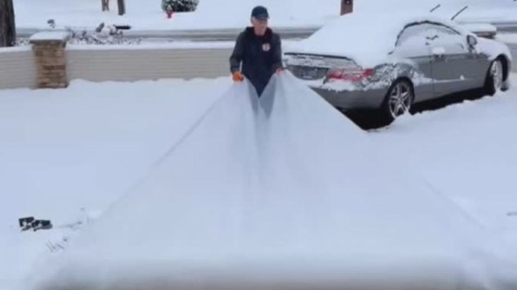 Dad uses an innovative snow hack to remove snow from his walkways.