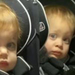 Twin toddlers showing instant regret about becoming big sisters when the baby cries.