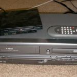 Image shows a VHS player and DVD recorder to convert VHS tapes to DVDs.