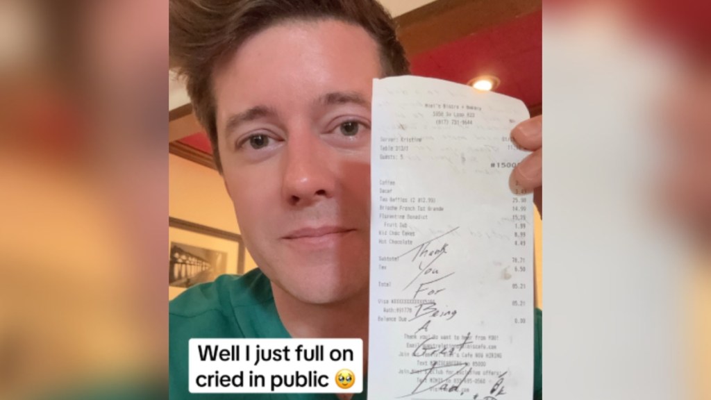 Close up of a man holding up a receipt. There's a tear on the man's cheek near his eye. Handwriting on the receipt reads: Thank you for being a great Dad! Text on the image reads: Well I just full on cried in public