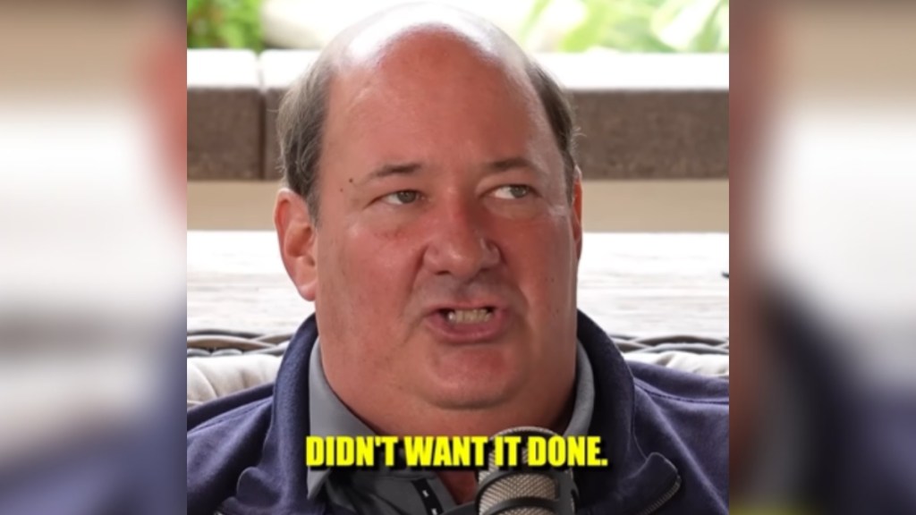 Close up of Brian Baumgartner talking. Text on the image show what he's saying: "... didn't want it done..."