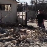 A man and woman approach their totally destroyed house from the LA fires.