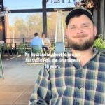 A man sitting at a restaurant.